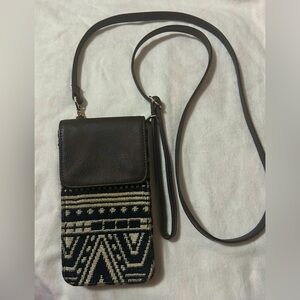 Black and white cross body bag/phone holder.